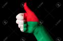 12745_13207903-Hand-with-thumb-up-gesture-in-colored-madagascar-national-flag-as-symbol-of-excellence-achievement-g-Stock-Photo.