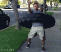 26338_Guy_Hula_Hoops_a_100-Pound_Tire.