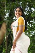 60875_after-rima-kallingal-in-white-saree-yello-blouse.