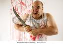 725stock-photo-crazy-insane-butcher-covered-with-blood-harsh-lighting-for-more-disturbing-feel-slight-motion-42039979.